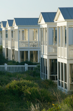 Cottages in Seaside, FL attract visitors with unique architecture and pedestrian-friendly community planning. Photo by Walton County TDC.