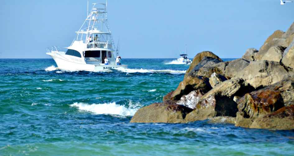 Fishing boat heading through Destin's Pass to the Gulf of Mexico