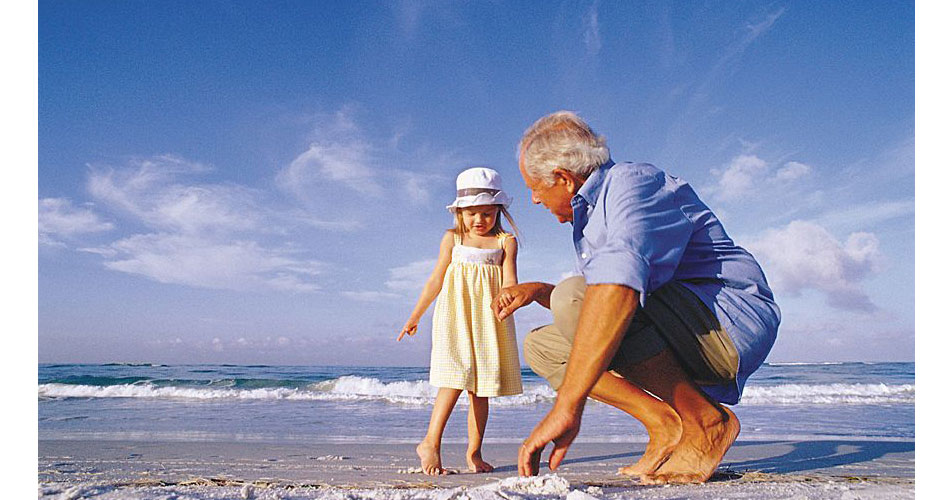 Sarasota little girl with grandfather on beach