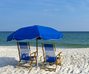 Beach chairs on the white sand beach in Gulf Shores AL