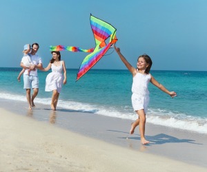 Flying a kite on the beach in Southwest Florida is fun for the whole family